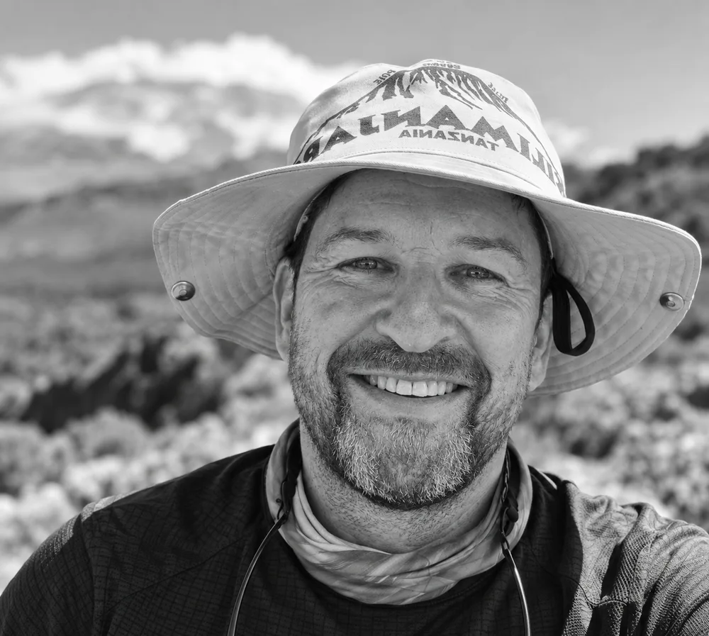 David Holloway smiling in a hiking hat